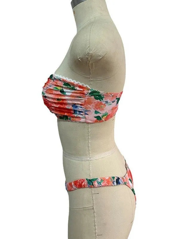 Women's polyester bikini set with floral print tube top and matching briefs for swimming.