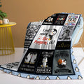 Multicoloured penguin flannel velvet throw blanket on sofa with hemmed edges