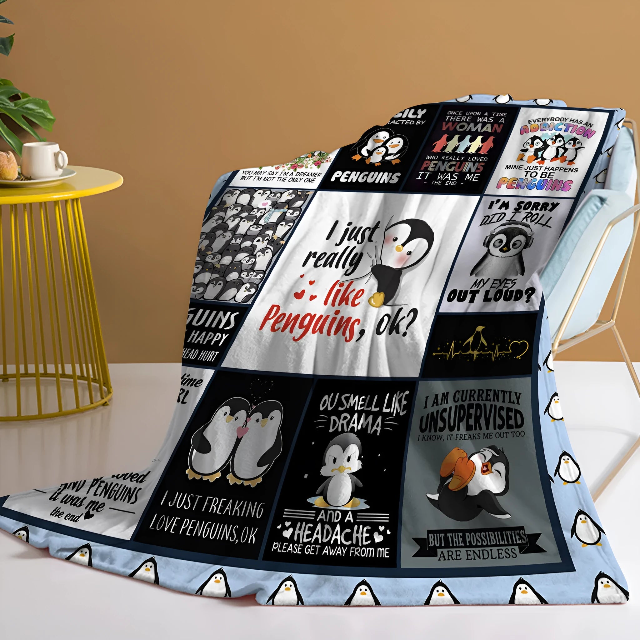 Multicoloured penguin flannel velvet throw blanket on sofa with hemmed edges