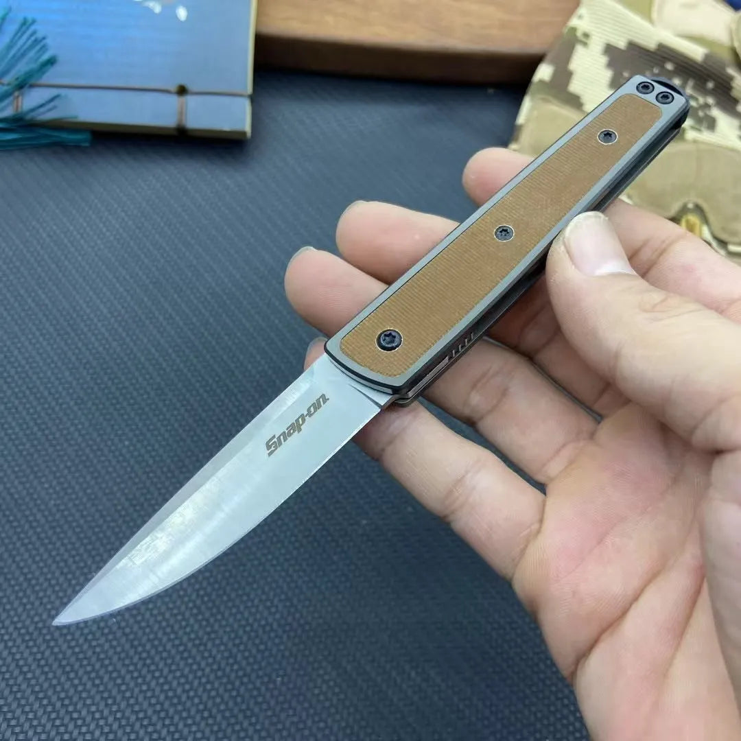 CRKT 7190 folding fruit knife with stainless steel blade in black, red, or coffee colour, showing closed and open positions