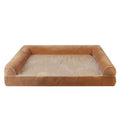 A dark grey, rectangular sponge dog bed with a removable cloth cover, shown inside a metal wire crate.