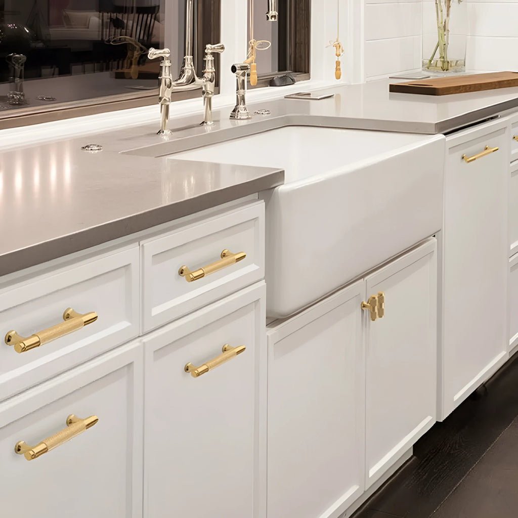 Brushed brass aluminium wardrobe handle with visible mounting holes for cabinet furniture.