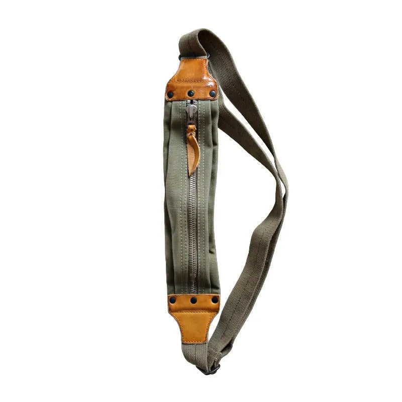 Green retro military style chest bag made from canvas with Italian leather trim