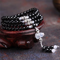 Black agate bracelet with 108 geometric natural stone beads on adjustable fastening