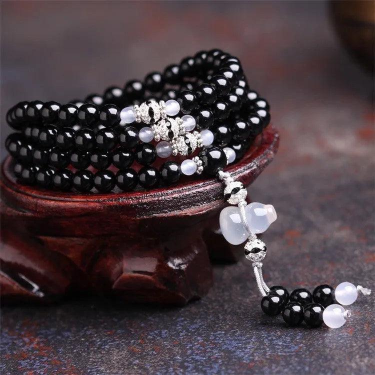 Black agate bracelet with 108 geometric natural stone beads on adjustable fastening