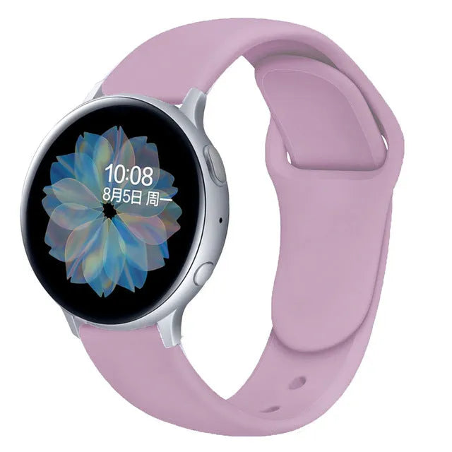 Samsung Galaxy Active 2 watch with a purple reverse buckle silicone strap on a wrist.