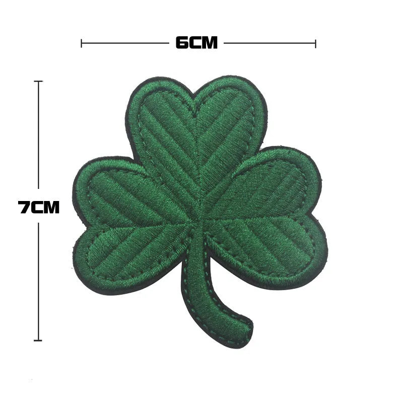 Embroidered fabric badge with Velcro backing showing camo pattern in green colour