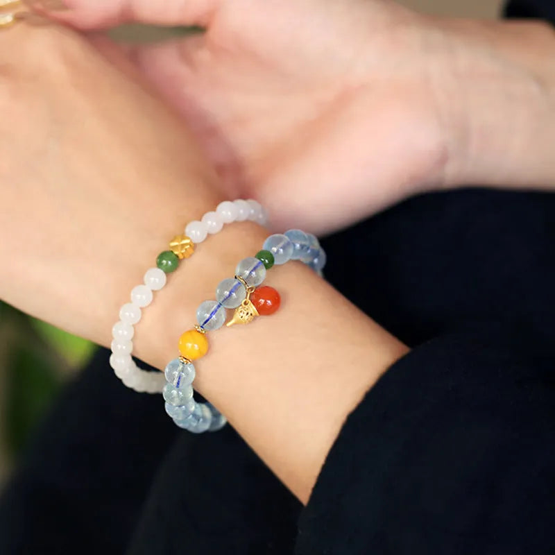 Iced aquamarine crystal bracelet with 8mm geometric beads and retro ethnic styling details