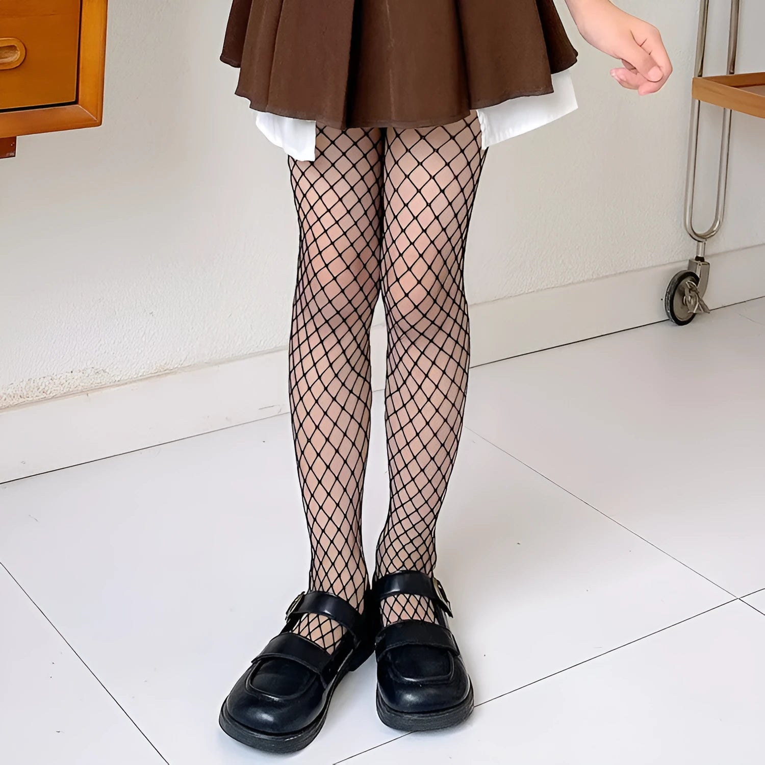 Women's sheer mesh pantyhose showing large, medium, and small mesh patterns in black and white colours.