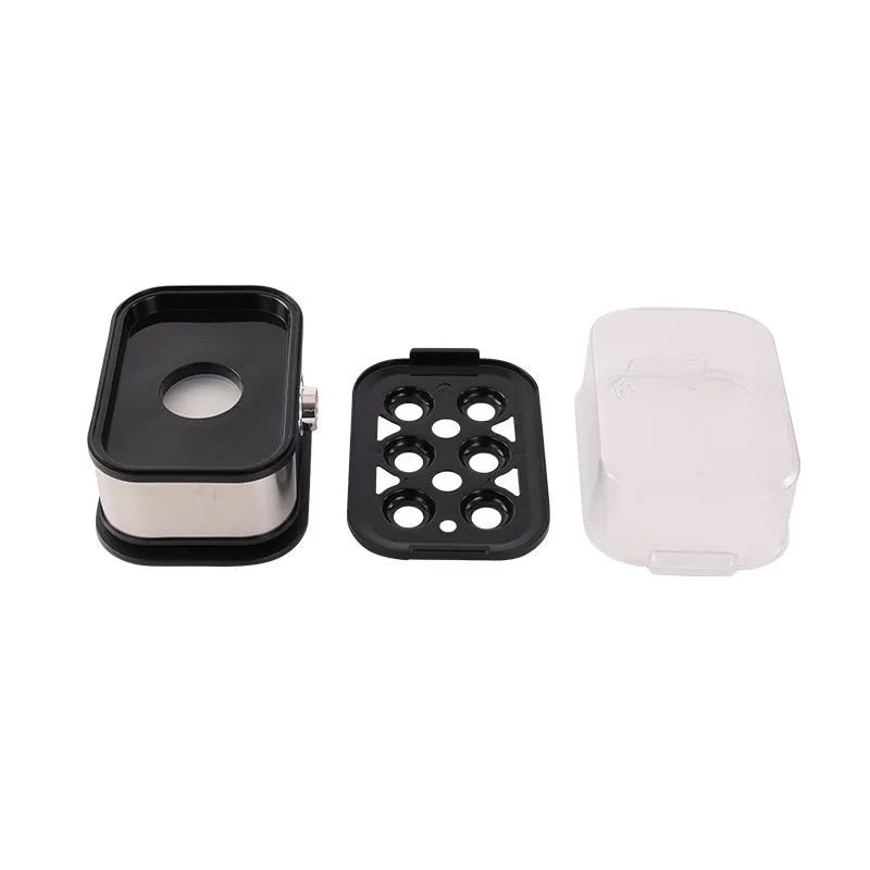 Black portable stainless steel egg boiler with a carrying belt for travel use.