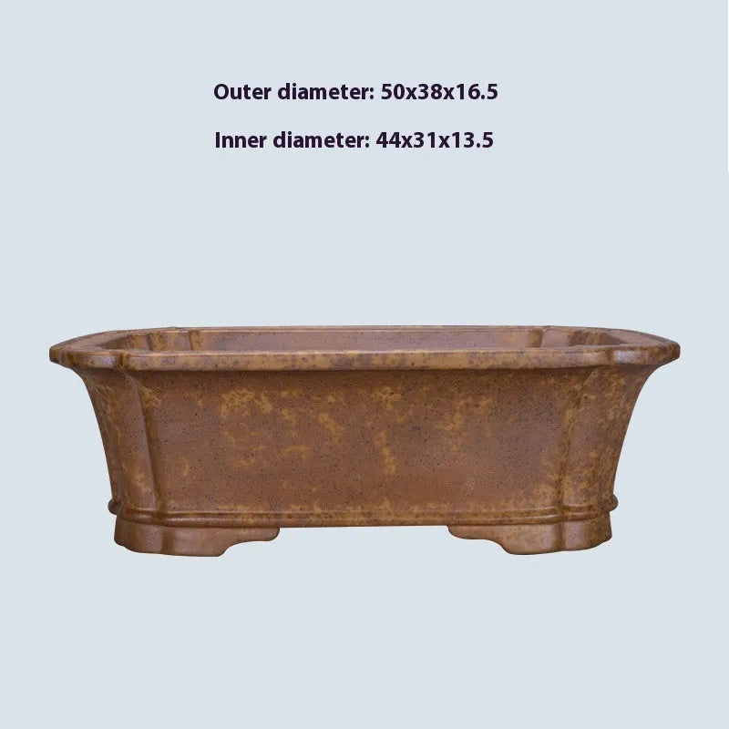 Modern rectangular purple sand floor planter with a visible water level gauge on its side.