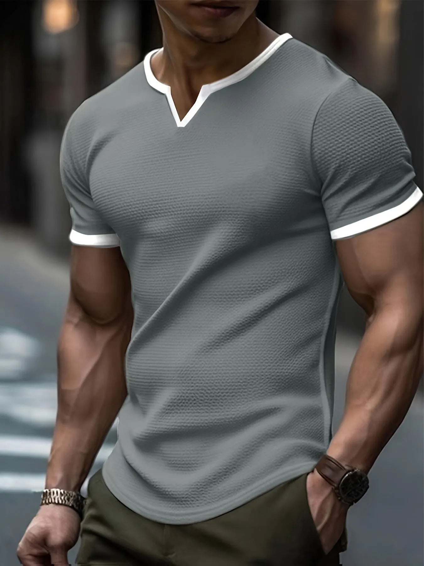 Colour-block V-neck short sleeve t-shirt in polyester waffle fabric on a neutral background.