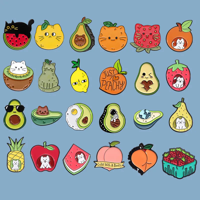Colourful cartoon-style fruit metal brooch with pin clasp on a denim jacket lapel.