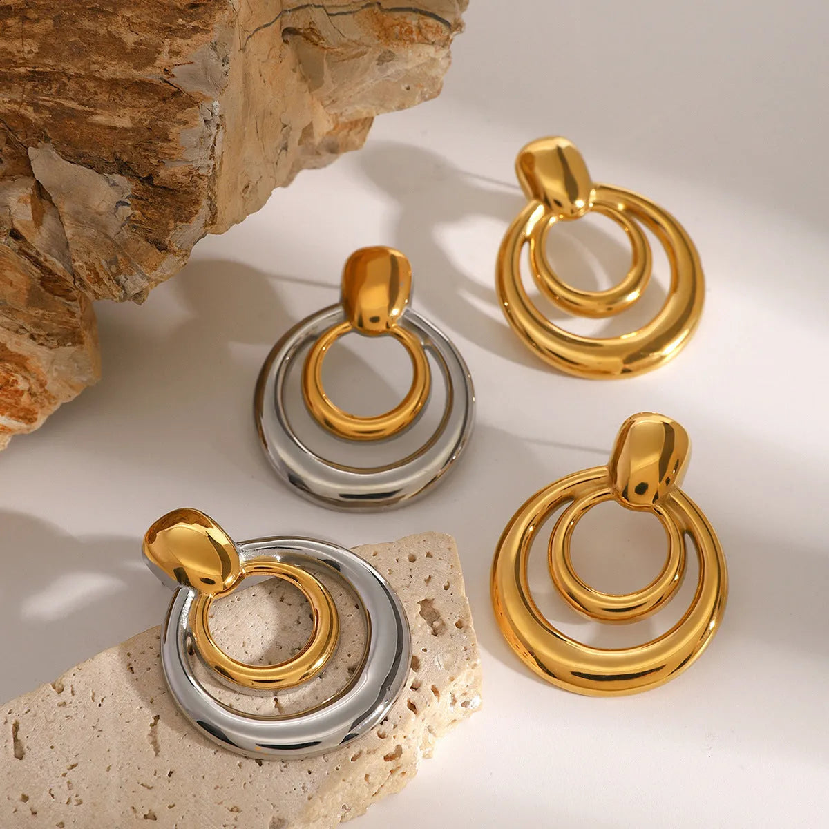 18K gold electroplated titanium steel hollow stud earrings with double layer geometric round design