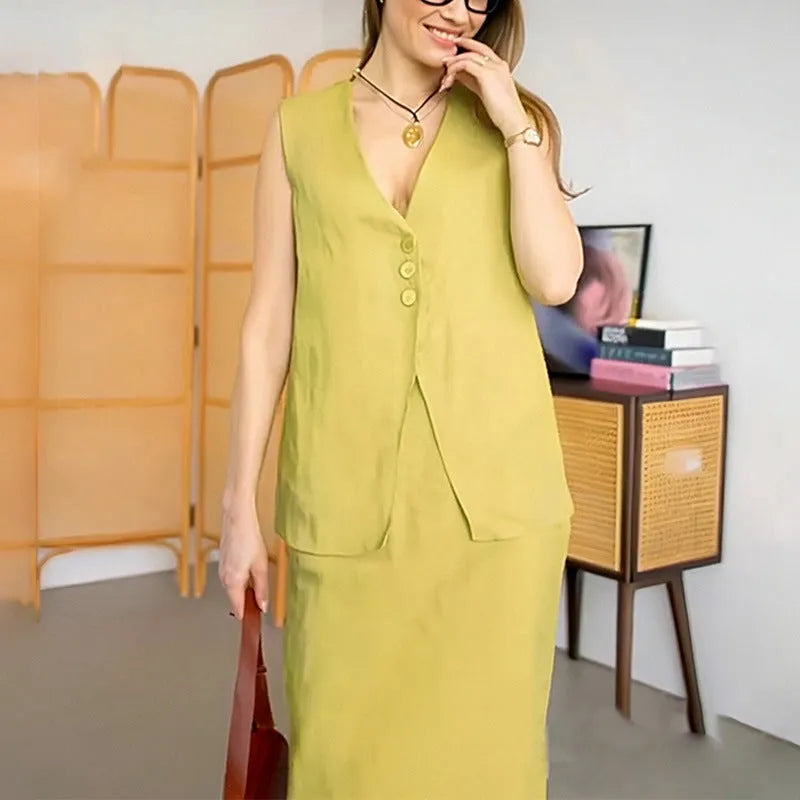 A woman's blue sleeveless vest and long skirt two-piece suit on a hanger.