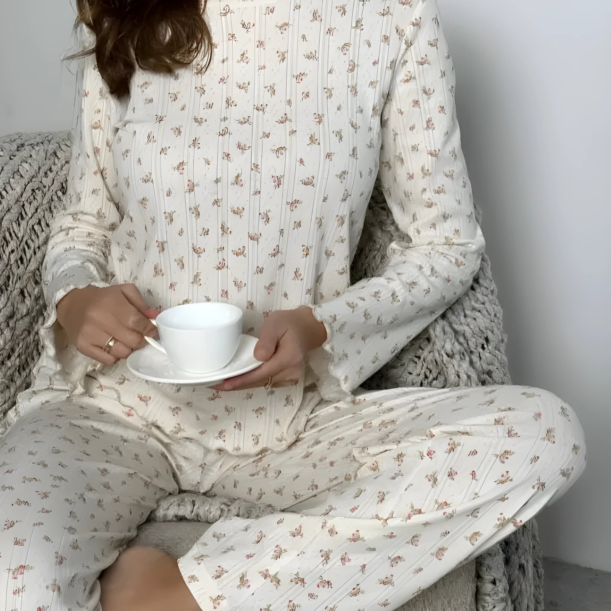 White floral print women's co-ord suit with bell sleeve top and wide leg trousers