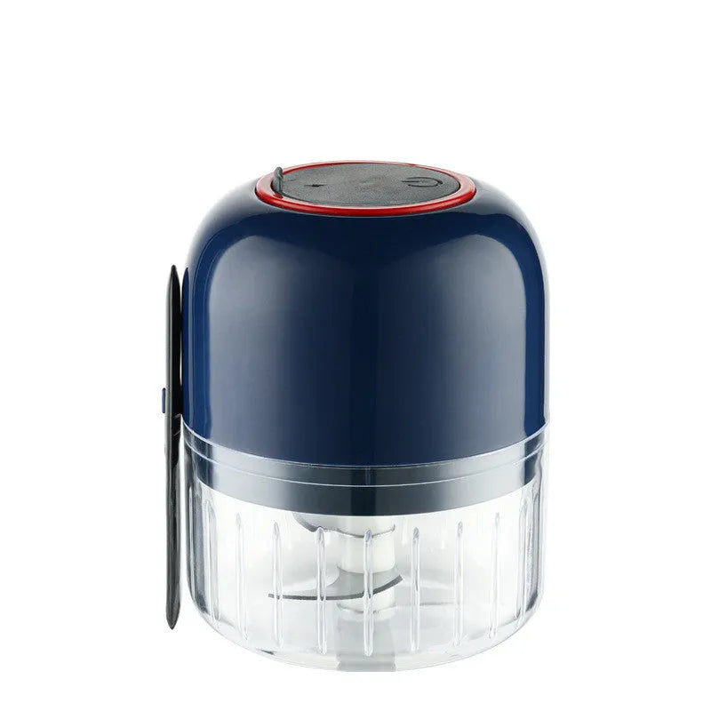 Blue electric garlic masher mini with compact plastic body on kitchen counter