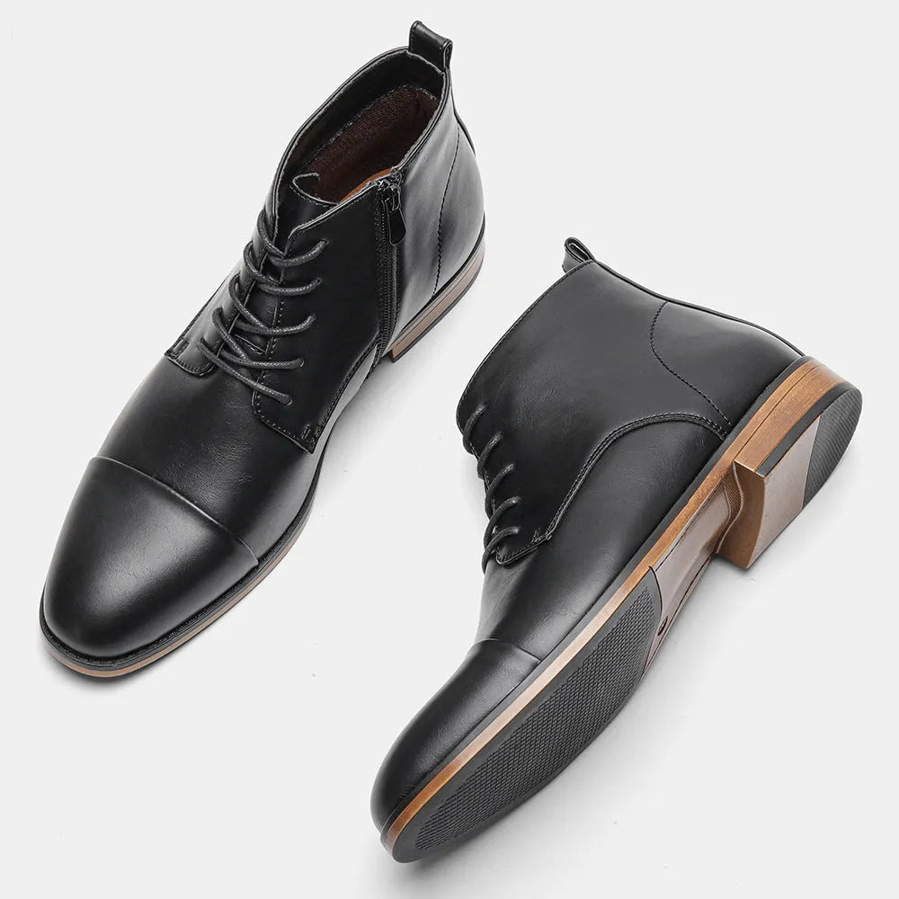 Men's brown Chelsea boot with a side zip, round toe, and low wooden heel on a white background.