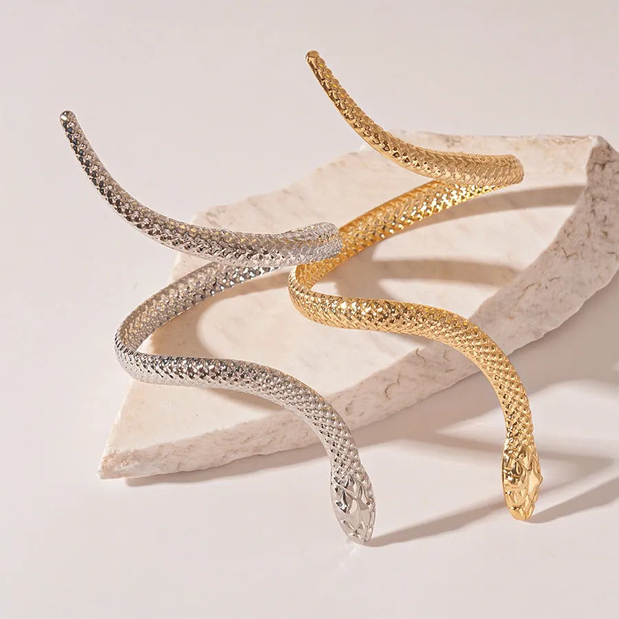 Gold and silver exaggerated twisted snake design metal ring and bracelet jewellery set