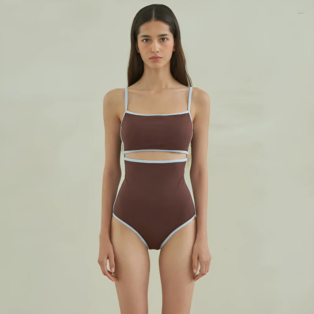 Brown women's triangle one-piece nylon swimsuit on a hanger.