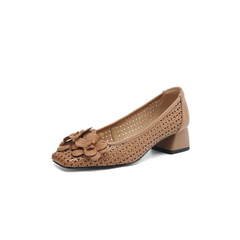 Women's light brown cowhide leather open weave pumps with a mid heel on a neutral background.