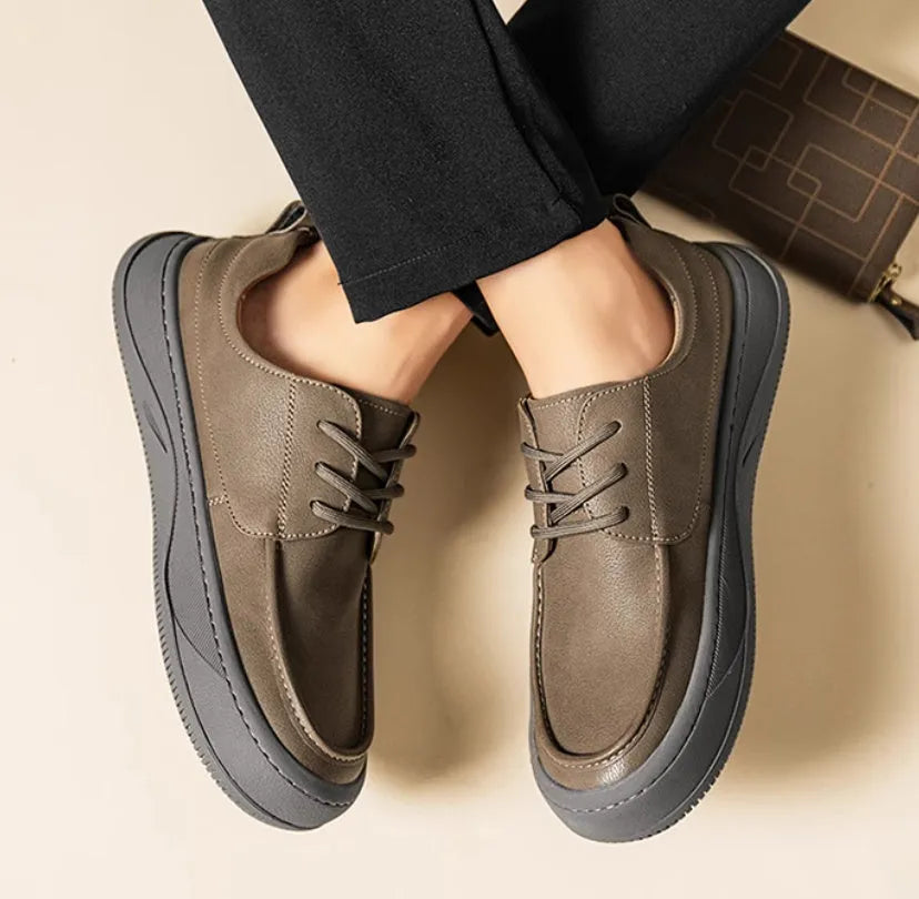 Brown retro casual leather shoes with big toe design and stitching, shown on a white background.