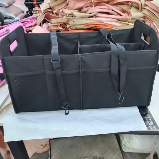 Foldable black car boot storage box with compartments and carry handle showing 56x32x32 cm dimensions