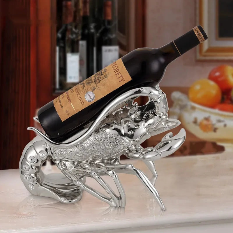 Lobster-shaped wine rack ornament in rose gold or silver holding wine bottle