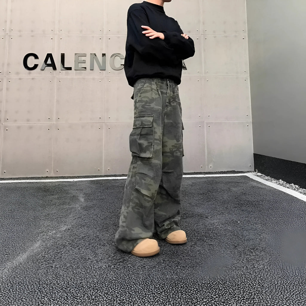 Men's olive and brown washed camouflage cargo trousers with multiple pockets on the thighs and sides.