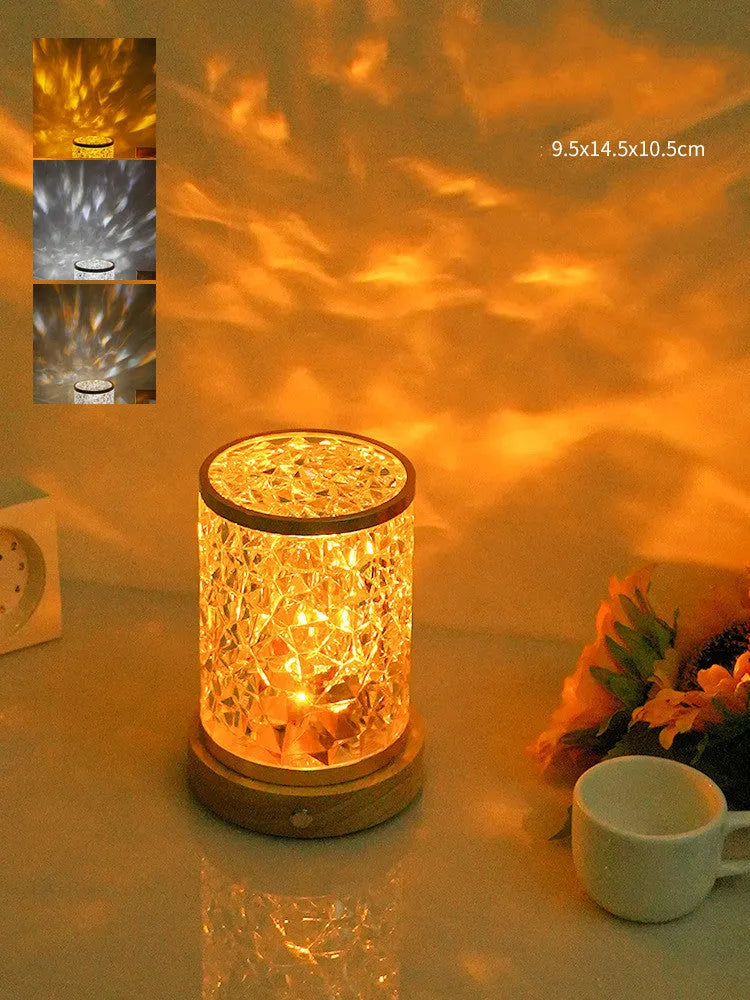 Rotating water ripple effect small night light with acrylic shade on a solid wood base.