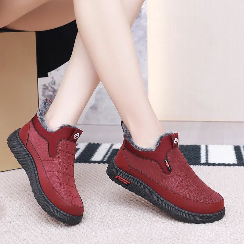 Women's black flat casual ankle boots with round toe and synthetic leather upper