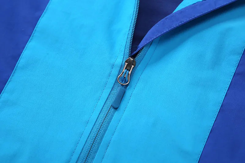 Boys' blue sanded acetate fibre autumn jacket with long sleeves and front zip.