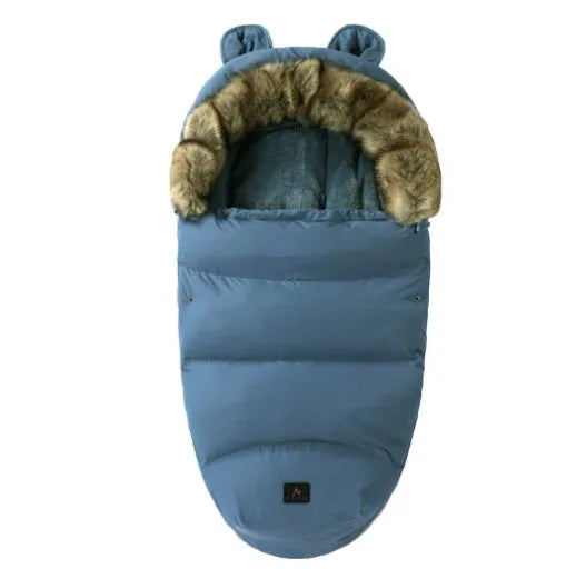 Baby warm cocoon style sleeping bag on a neutral background demonstrating solid colour design with zip closure