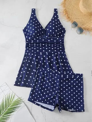 Blue polka dot print women's plus size bikini swimsuit top and briefs.