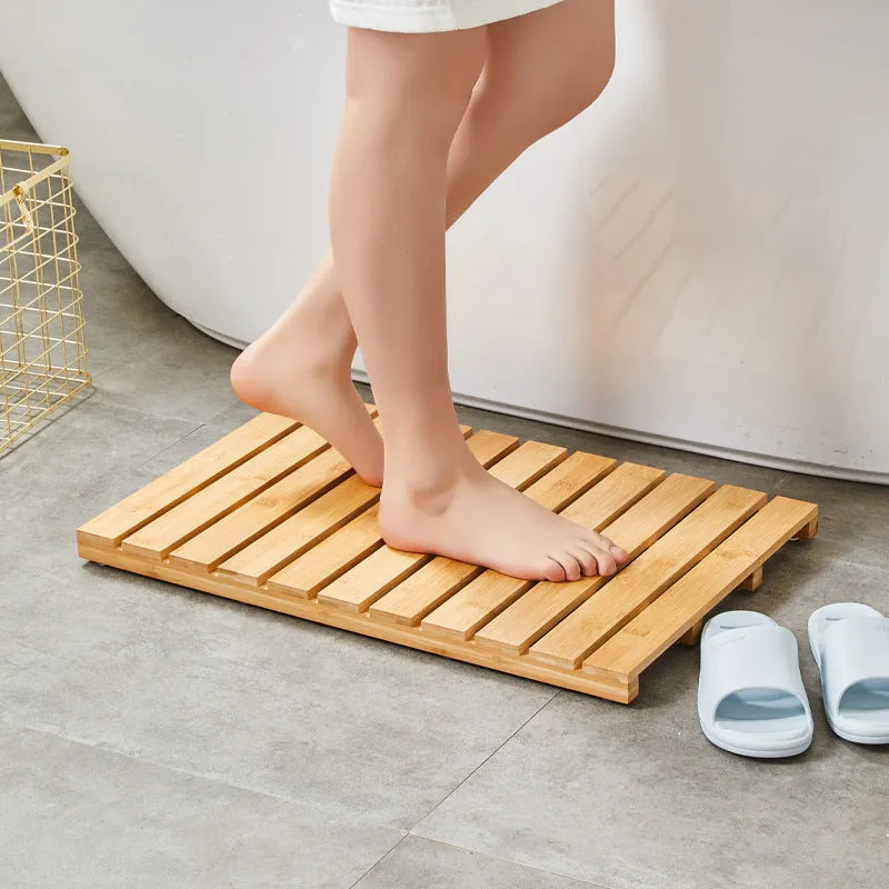 Bamboo bathroom height increasing non-slip foot pad in solid colour, 54x36x4cm rectangular shape.