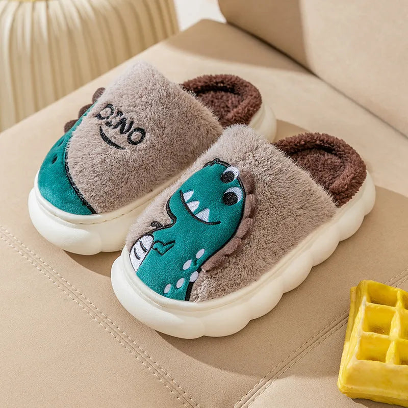 A pair of plush cotton dinosaur slippers with a thickened sole, shown in grey, coffee, and orange-yellow colour options.