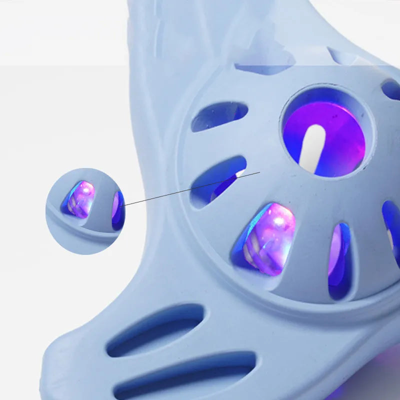 Blue or purple bite-resistant boomerang dog toy for medium and large breed chewing and fetch play.