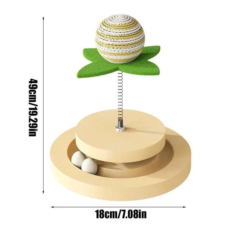 Green cat toy with a sisal scratching centre and a circular plastic ball track on a turntable.