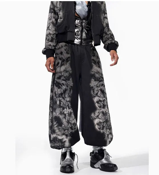 Streetwear co-ord set showing hoodie, full-length trousers, and seven-inch shorts with printed design and collage stitching detail.