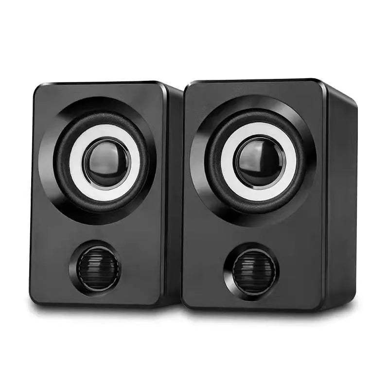 A pair of black plastic USB mini multimedia speakers with wired connection