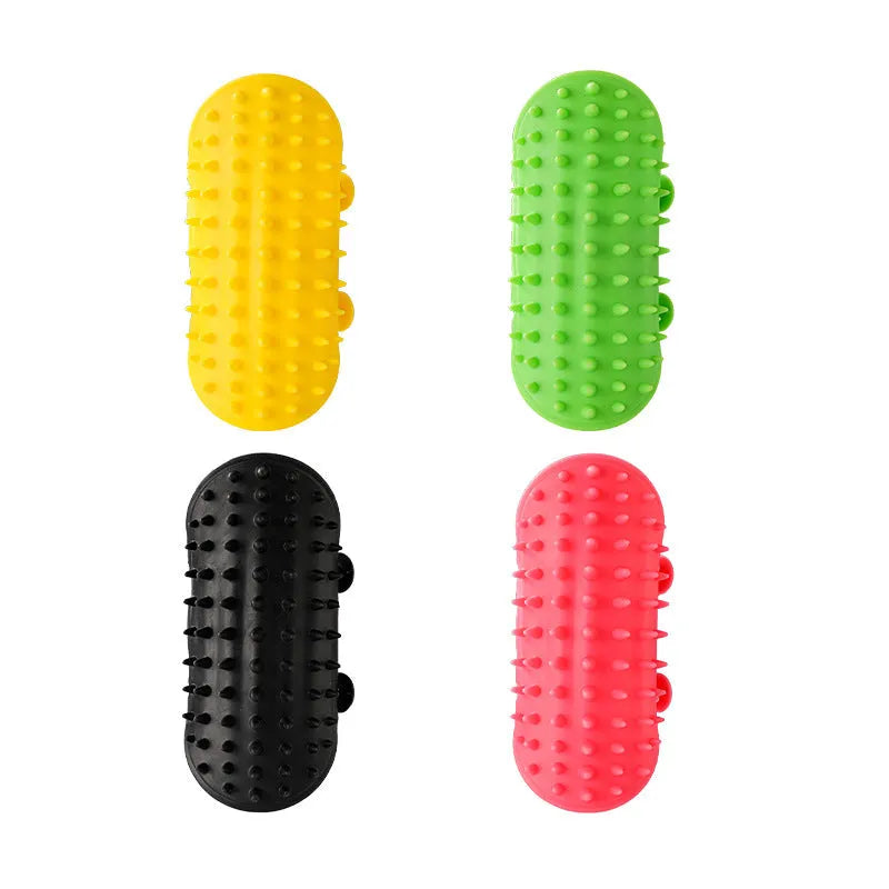 Silicone cat grooming comb with rounded teeth and adjustable strap mounted on a table leg.