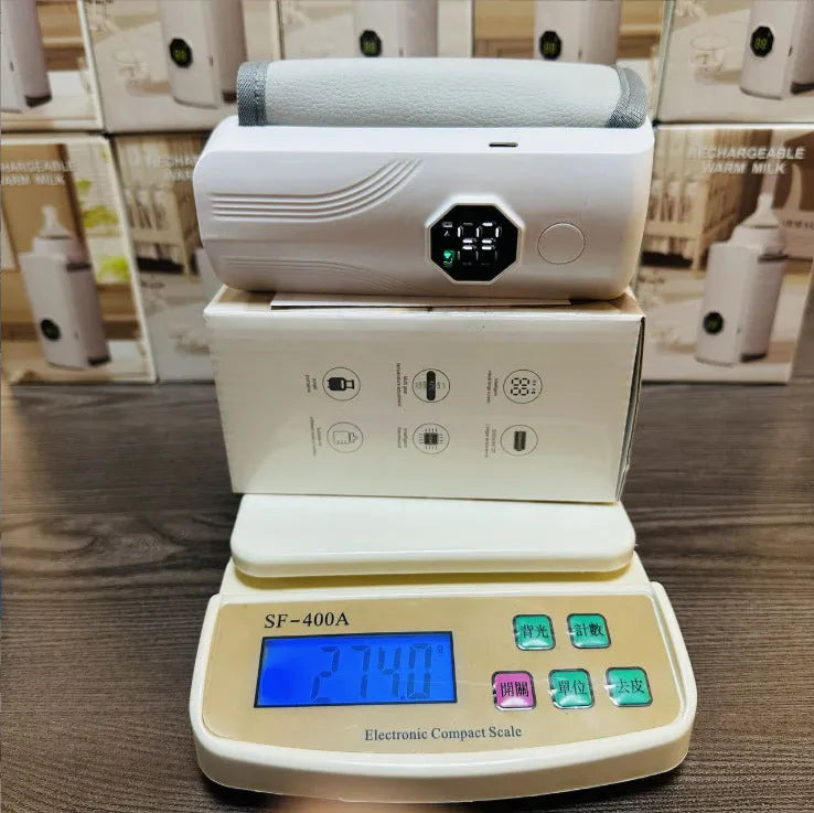 Grey and white car charger electric milk warmer for baby bottles.