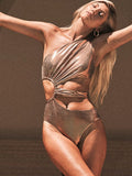 Gold women's one-piece swimsuit with backless design and spandex construction