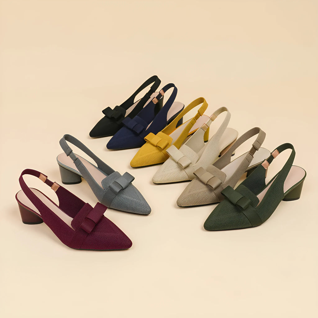 Women's closed toe high heel sandal with back ankle strap in a solid colour, showing pointed toe and fabric upper.