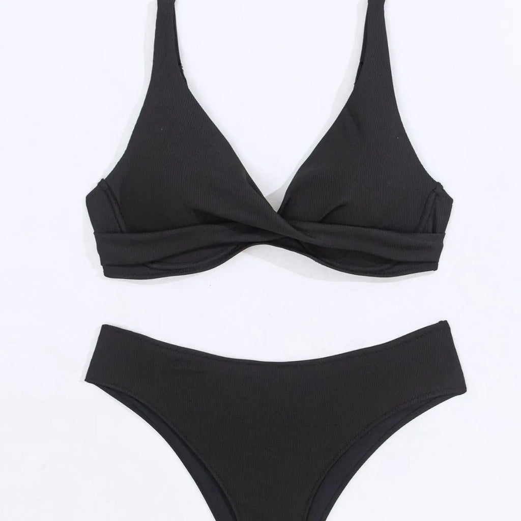 Women's black rib fabric two-piece bikini set with briefs-style bottoms on a mannequin.