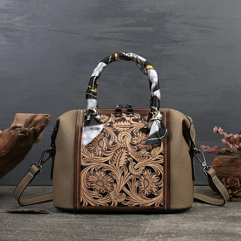 Brown vintage-style leather messenger bag with a flap closure, shown with internal organiser pockets open.