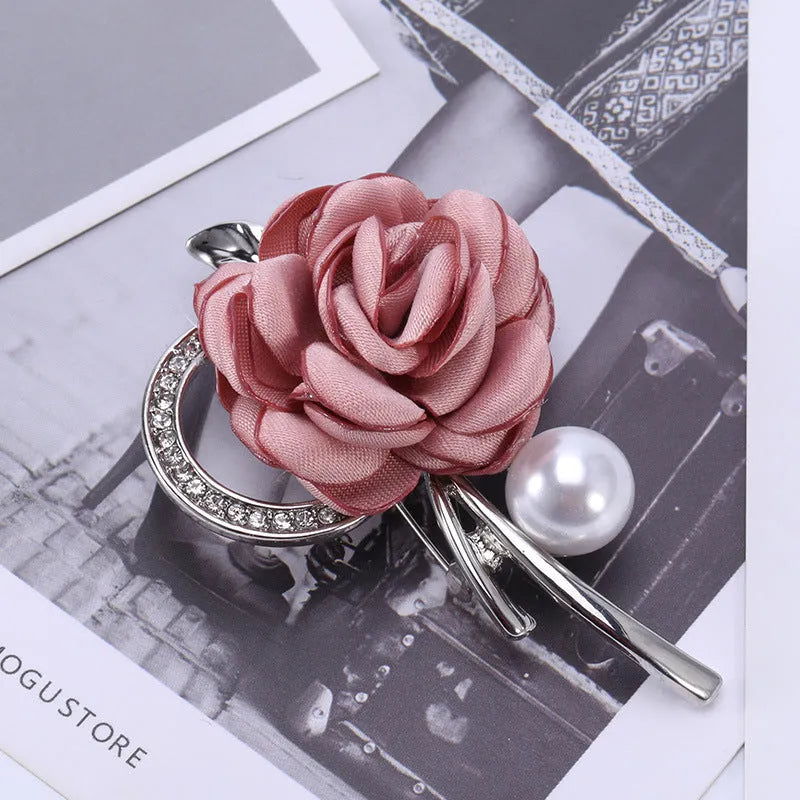 Rose brooch in Korean style, alloy construction, blue colour, 4.5cm by 3.8cm, on white background