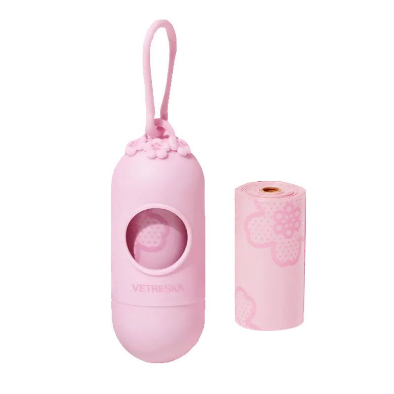 Colourful dog poo bag dispenser capsule with a roll of scented, biodegradable waste bags for dog walks