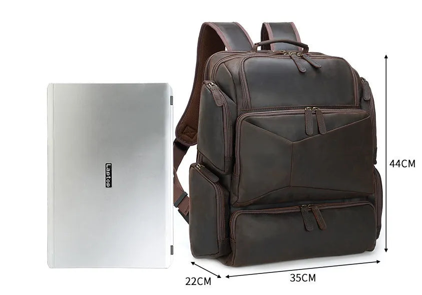 Dark brown genuine leather backpack for a 17-inch laptop, showing multiple pockets and double shoulder straps.