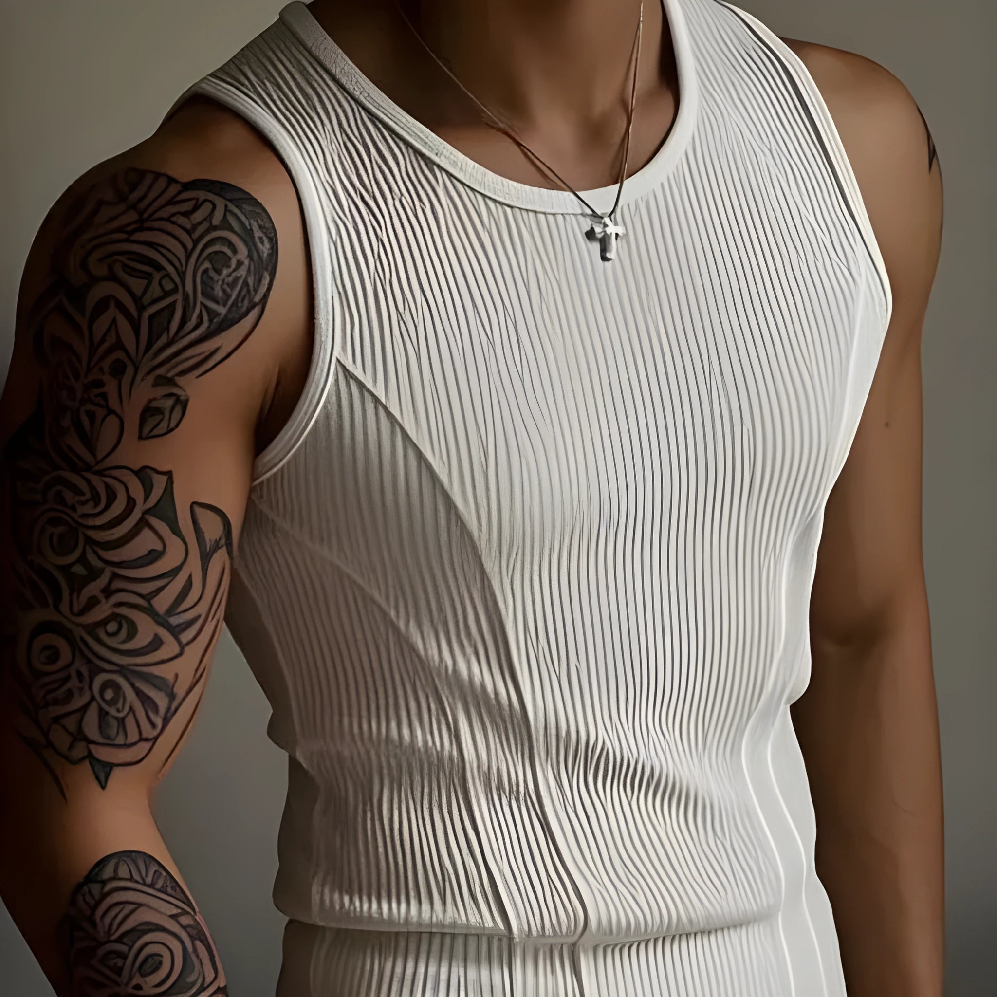 Black men's tight-fitting I-vest tank top with American stitching on a plain background.
